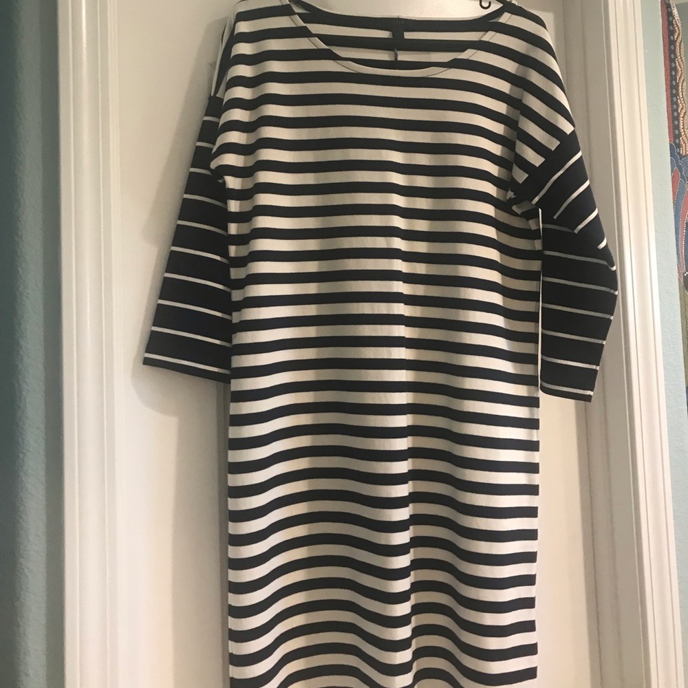 Navy blue and white. NWT. Size small runs big